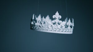White crown suspended by thin wires, on a dark blue background