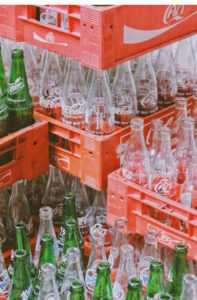 Empty glass soft drink bottles in plastic crates