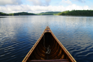 Front end of a canoe on a lake